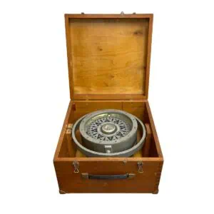 vintage ship compass inside wooden box open with handle visible