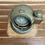 brass navigation housing top view patina detail