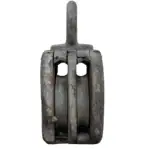 Side profile of vintage wooden pulley displaying two sheaves and iron loop, rustic maritime decor