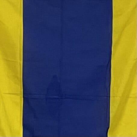 Letter D Signal Flag - 35 x 29 Nautical Wall Decor 01 Blue and yellow nautical signal flag hanging on display close up