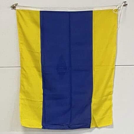 Letter D Signal Flag - 35 x 29 Nautical Wall Decor 03 Vertical view of the Blue and yellow nautical signal flag hanging on display