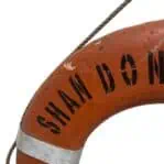 vintage ship life ring SHANDONG EXPRESS Panama close up of ship lettering and reflective tape