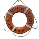 close up of SHAN DONG EXPRESS Panama ship life ring showing paint wear and original markings