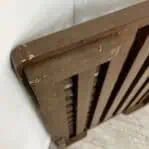 Close-up of the 1-inch riser detail on the back of the wooden grate.