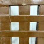 Detailed view of the wood texture and weathered finish on the grate.