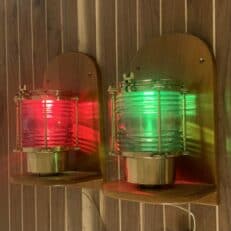 Nautical Red And Green Perko Navigation Lights On Wood Shelves