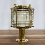 Brass marine dock fixture showing Fresnel glass globe