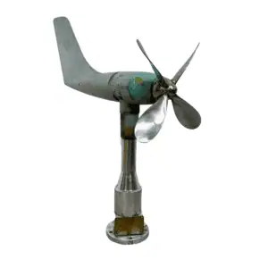Weathered nautical vane anemometer salvaged from a ship, featuring an aluminum body, fiberglass tail, and maritime patina.