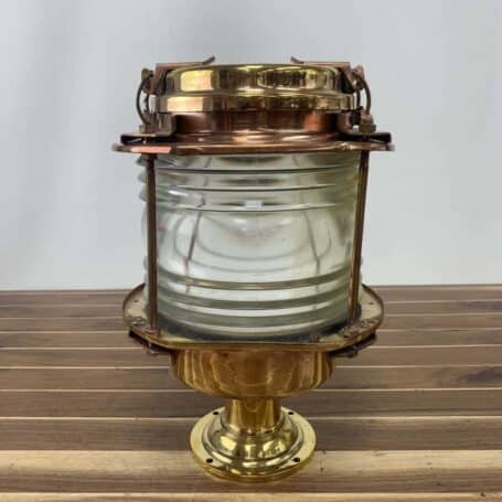 Side view of ship-salvaged brass pier light showing durable construction and clear lens.