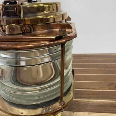 Close-up of flat side on brass pier light housing for easy mounting against flat surfaces