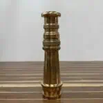 Vintage Brass Fire Hose Nozzle standing upright on its side