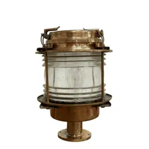 Side view of brass nautical post light with clear glass lens