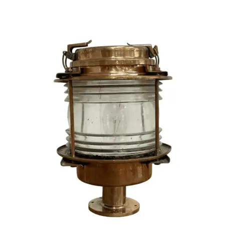 Side view of brass nautical post light with clear glass lens