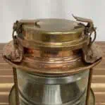 Detailed shot of lid and clasp on brass nautical post light