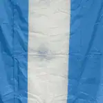 Close-up of salvaged Argentina nautical flag with visible wear