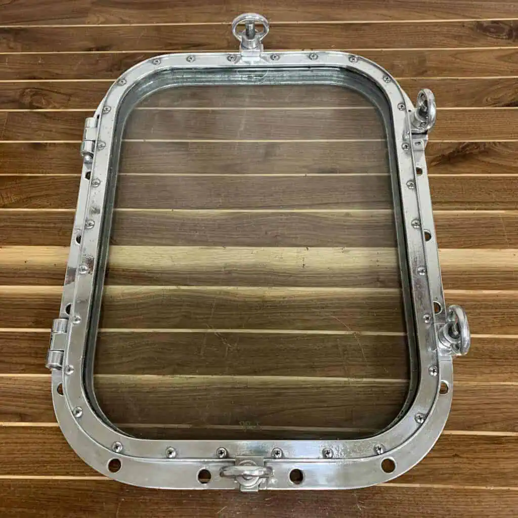 Salvaged Aluminum Porthole With Four Aluminum Dogs - 28" x 22"