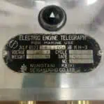 Close-up of manufacturer plate with AMAGASAKI, JAPAN text