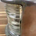 Close-up of the clear Fresnel lens with a visible gap.