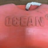 the word ocean on buoy