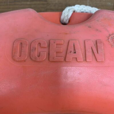 the word ocean on buoy