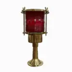 Front view of brass post mounted light on white background