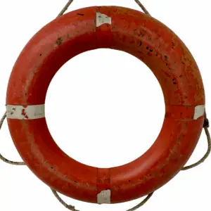 Main view of salvaged weathered orange life ring with rope and faded surface