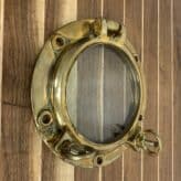 Small Brass Ships Porthole With Two Dogs-on wall