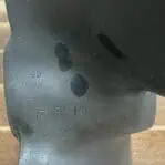 Close-up of Michigan 17 RH 14 stamp on vintage brass boat propeller blade