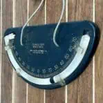 Introducing an authentic piece of maritime history: this original Vintage WW II Clinometer: Mark 4 Mod 0, was crafted by John L. Chaney Instruments Co. It was manufactured in Lake Geneva, WISC for the US government to provide wartime aid during WWII. Clinometers played a crucial role aboard ships, they were mounted on bulkheads in pilothouses or bridges to gauge the vessel's roll or pitch angle. It is constructed from black bakelite and proudly stamped with Clinometer, Mark 4 Mod 0., John L. Chancey Instrument Co., and Lake Geneva, WISC. The bakelite does show some light weathering. It's a must for collectors of the U.S. Navy, WW II, or maritime memorabilia.