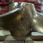 Close-up of markings on salvaged bronze propeller blade.