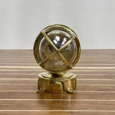 Bottom view of vintage brass wall sconce with brass junction box