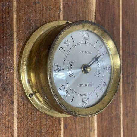 Brass Ship Tide Clock - 3.75 Seth Thomas Nautical Dial 03 brass ship tide clock angled wall mount view with brass casing