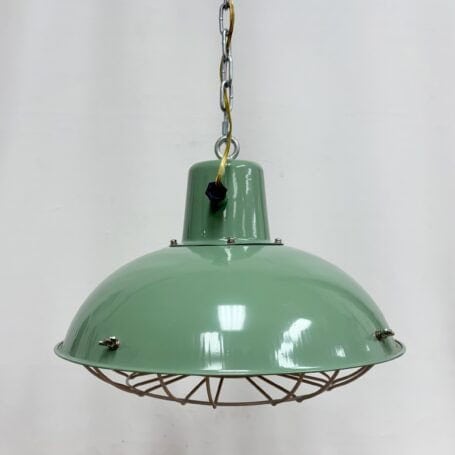 Industrial Seafoam Enamel Caged Pendant Light A Industrial Seafoam Enamel Caged Pendant Light side view showing the wiring exit detail.