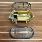 Clear oval glass marine light disassembled