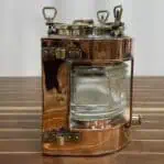 Copper and brass running light side profile with clear Fresnel lens