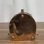 Copper and brass running light bottom panel showing aged copper patina