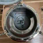 Copper and brass running light interior view showing lens and housing