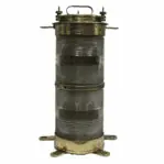 Front view of vintage marine navigation light with double-stacked Fresnel lens in brass by Forcato-Verona on white background