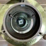 Inside view of marine navigation light showing internal components and double-stacked Fresnel lens