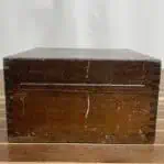 Closed wooden case for Cassens & Plath sextant showing exterior wear and hinges