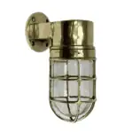 Solid brass dock light shown on white background with clear lens and nautical design