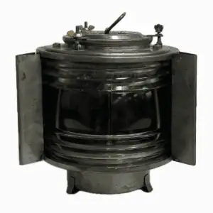 Front view of vintage galvanized 225 degree running light with glass lens and mounting bracket