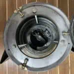 Top-down interior look into socket of vintage galvanized 225 degree running light