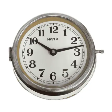 Main: Front view of Vintage HANIL Ship Clock with cream face and steel case