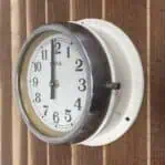 Side Angle: Side angle of Vintage HANIL Ship Clock showing depth and glass face