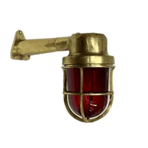 Side View of Brass Wall Light with Red Glass Globe