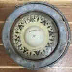 Top-down view of vintage Sestrel compass face and markings