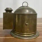 Brass marine binnacle housing showing compass burner side