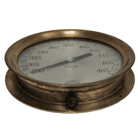 Brass Steam Gage by Crosby Steamgage and Valve Number985778 - Side Side angle of a brass steam gage with clear glass cover and visible gauge markings
