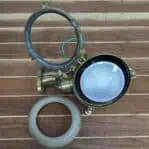 Disassembled parts including bulb socket and mounting hardware